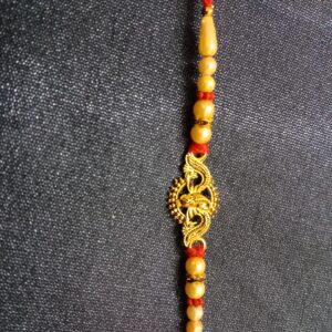 Designer Ganesha Pendant Rakhi Bracelet in Gold Colour